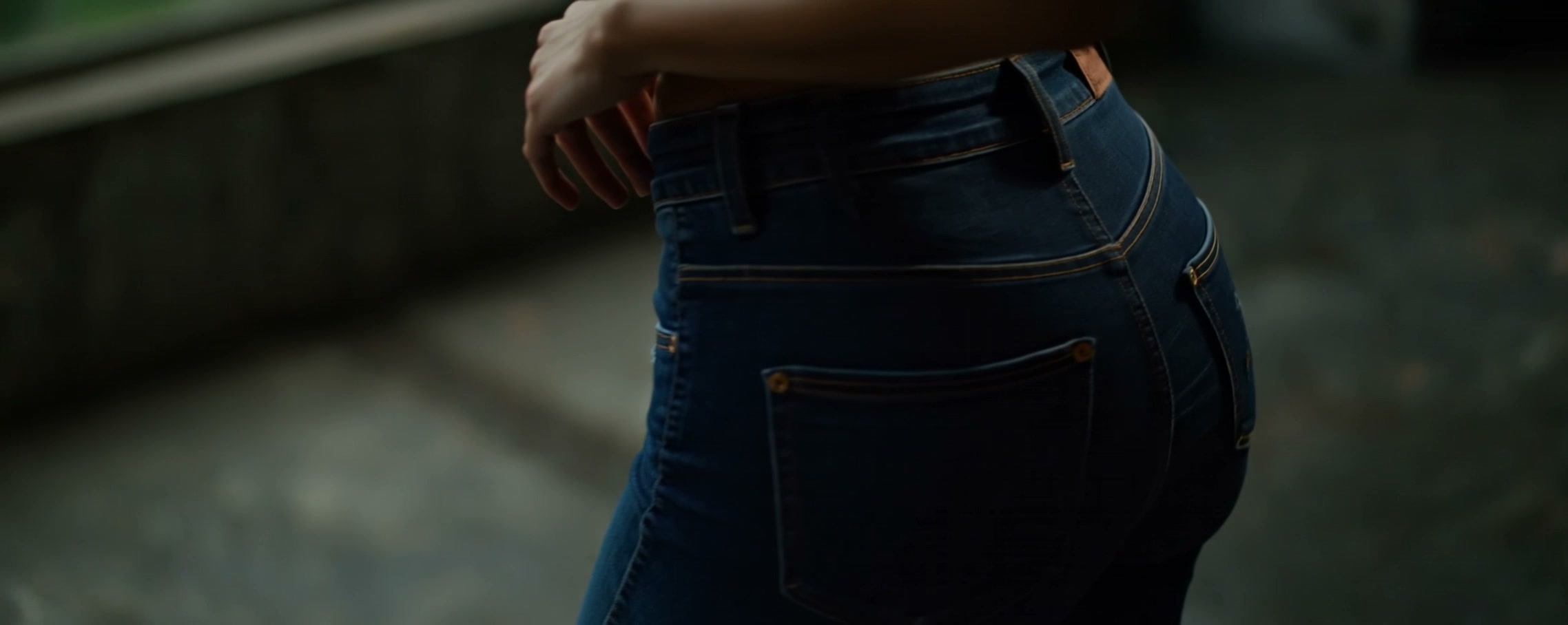 Frame from the AI Fashion Film: the performer's 360-degree turn in denim